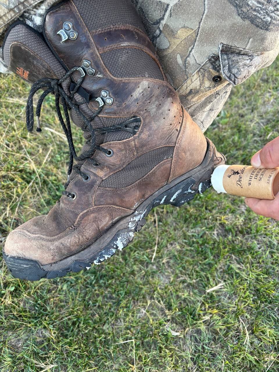 Deer scent stick applied to boots
